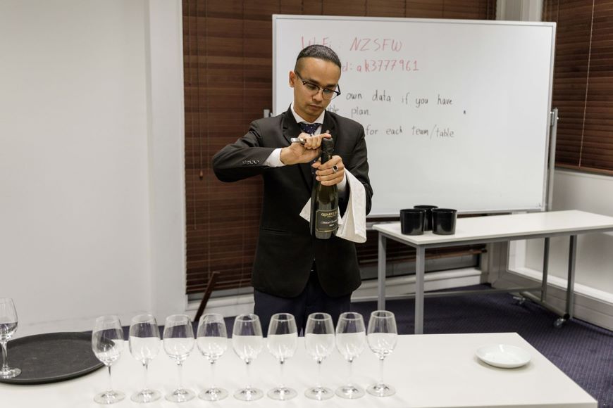 New Zealand Sommelier of the year 2024 Suraj GC Pouring